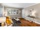 Cozy living room showcasing hardwood floors, a large window with shutters, and stylish decor at 1990 Wellbourne Dr # 5, Atlanta, GA 30324