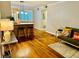 Bright living area with hardwood floors, kitchen bar, and cozy seating at 1990 Wellbourne Dr # 5, Atlanta, GA 30324