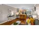Open concept living room leading to kitchen, featuring hardwood floors and a breakfast bar at 1990 Wellbourne Dr # 5, Atlanta, GA 30324