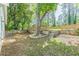 Backyard with lawn, tree feature, and AC unit at 3275 Dodson Dr, East Point, GA 30344