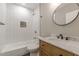 Charming bathroom featuring tub and shower combo, subway tile, and wood vanity at 3275 Dodson Dr, East Point, GA 30344