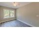 Minimalist bedroom with large window for natural light, and neutral wall color at 3275 Dodson Dr, East Point, GA 30344