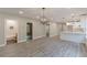 Vacant living space connects to the kitchen with modern dining area at 3275 Dodson Dr, East Point, GA 30344