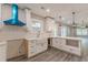 Contemporary kitchen with white cabinets, quartz countertops, stainless steel appliances and gray flooring at 3275 Dodson Dr, East Point, GA 30344