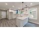 Bright kitchen with white cabinets, stainless steel appliances, and a stylish breakfast bar at 3275 Dodson Dr, East Point, GA 30344
