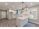 Bright kitchen with modern appliances and a marble countertop island at 3275 Dodson Dr, East Point, GA 30344