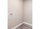 A basic laundry room area with painted walls and a wood-look flooring at 3275 Dodson Dr, East Point, GA 30344