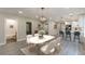 Open-concept living and dining area featuring modern lighting, sleek flooring, and access to a bathroom and kitchen at 3275 Dodson Dr, East Point, GA 30344