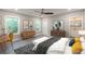 Bright main bedroom featuring multiple windows, modern furnishings, and an ensuite bathroom at 3275 Dodson Dr, East Point, GA 30344