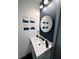Stylish bathroom with a modern vanity, sleek fixtures, a round mirror, and decorative wall art at 3593 Adkins Nw Rd, Atlanta, GA 30331