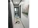 Hallway featuring a patterned runner and contemporary artwork that leads to a bright, inviting living space at 3593 Adkins Nw Rd, Atlanta, GA 30331