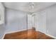 Bedroom with hardwood floors, neutral walls, closet, ceiling fan and bright natural light at 3650 Croft Nw Pl, Atlanta, GA 30331