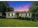 Charming single-story home featuring a well-maintained lawn, white siding, and contrasting green shutters and door at 3650 Croft Nw Pl, Atlanta, GA 30331