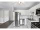 Bright kitchen featuring stainless steel appliances, white cabinetry, and modern finishes for a sleek look at 3650 Croft Nw Pl, Atlanta, GA 30331