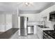 Updated kitchen with white cabinets, stainless steel appliances, subway tile backsplash and light gray walls at 3650 Croft Nw Pl, Atlanta, GA 30331