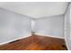 Bright living room boasts gleaming hardwood floors and neutral paint, providing a welcoming atmosphere at 3650 Croft Nw Pl, Atlanta, GA 30331