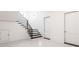 Basement staircase with black treads, sleek black handrails, and two white paneled doors on either side at 5211 Powers Ferry Rd, Sandy Springs, GA 30327
