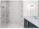 Bathroom boasting marble shower, dark vanity, and marble countertops at 5211 Powers Ferry Rd, Sandy Springs, GA 30327