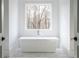 Elegant bathroom featuring a freestanding tub and large window with a view of the trees at 5211 Powers Ferry Rd, Sandy Springs, GA 30327