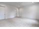 This bedroom features neutral walls, carpet, white trim, and two doors for entry and exit at 5211 Powers Ferry Rd, Sandy Springs, GA 30327