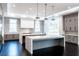 Bright kitchen boasting double islands, gray cabinetry, and modern lighting for a sophisticated cooking space at 5211 Powers Ferry Rd, Sandy Springs, GA 30327