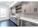 Kitchen featuring gray cabinets, stainless steel appliances, a window, and quartz countertops at 5211 Powers Ferry Rd, Sandy Springs, GA 30327