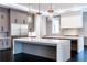 Modern kitchen design showcasing dual islands, stainless steel appliances, and stylish pendant lights at 5211 Powers Ferry Rd, Sandy Springs, GA 30327