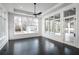 Light-filled living area with floor-to-ceiling windows and access to the outdoor pool at 5211 Powers Ferry Rd, Sandy Springs, GA 30327