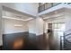 Spacious living room features dark hardwood floors, high ceilings, and modern lighting fixtures at 5211 Powers Ferry Rd, Sandy Springs, GA 30327