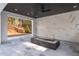 Outdoor living area with a cozy fireplace feature and a view of the backyard at 5211 Powers Ferry Rd, Sandy Springs, GA 30327