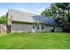 A charming home with a large backyard and lush green grass at 85 Chestnut Dr, Covington, GA 30016