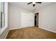 This bedroom features carpeted floors and a double closet at 85 Chestnut Dr, Covington, GA 30016