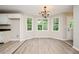 Cozy dining area with bay windows offering natural light and vinyl flooring at 85 Chestnut Dr, Covington, GA 30016