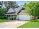 Well-maintained home with an attached two-car garage and a long driveway at 85 Chestnut Dr, Covington, GA 30016