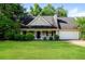 Charming single-story home with a welcoming front porch and well-maintained landscaping at 85 Chestnut Dr, Covington, GA 30016
