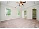 Relaxing main bedroom with tray ceiling, large windows, and neutral color palette at 85 Chestnut Dr, Covington, GA 30016