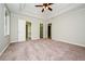 Spacious main bedroom features a tray ceiling, carpet floors and ensuite bath at 85 Chestnut Dr, Covington, GA 30016