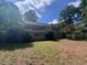 Large backyard with lush greenery surrounding the property at 2000 Brickton Sta, Buford, GA 30518
