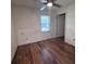 Bedroom features hardwood floors, natural light from the window, and closet with a modern touch at 2000 Brickton Sta, Buford, GA 30518