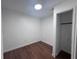 Bright bedroom with wood floors, closet, and natural light offers a simple, comfortable design at 2000 Brickton Sta, Buford, GA 30518