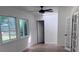 This sun-filled room boasts three windows, a fan, and French doors to the exterior at 2000 Brickton Sta, Buford, GA 30518