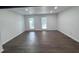 Spacious living room featuring recessed lighting, hardwood floors, and natural light from windows at 2000 Brickton Sta, Buford, GA 30518