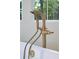 Close up of a modern gold faucet on a white soaking tub in a luxury bathroom at 3379 Rennes Ne Dr, Brookhaven, GA 30319
