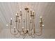 Decorative chandelier hanging from a vaulted, wood plank ceiling at 3379 Rennes Ne Dr, Brookhaven, GA 30319
