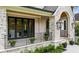 Charming porch with stone accents, black railings, and decorative plants creating an inviting entrance at 3379 Rennes Ne Dr, Brookhaven, GA 30319