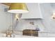 Close-up of a high-end range and marble backsplash in a modern kitchen, showcasing elegance and functionality at 3379 Rennes Ne Dr, Brookhaven, GA 30319