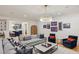 Comfortable living room with a decorative chandelier, comfortable seating, and wet bar at 3379 Rennes Ne Dr, Brookhaven, GA 30319