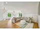 Spacious living room with a large sectional sofa, pitched ceiling, and natural light at 3379 Rennes Ne Dr, Brookhaven, GA 30319