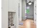 Hallway with built-in bench, storage cabinets, and a pet-friendly refreshment station at 3379 Rennes Ne Dr, Brookhaven, GA 30319