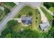 Aerial view of a home with a well-manicured lawn, mature trees, and a private backyard at 452 Emerald Trce, Jonesboro, GA 30236